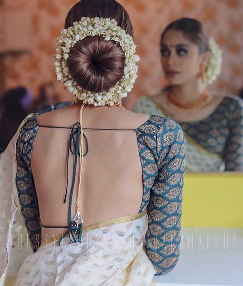 Trending: Bridal Floral Buns With Unique Elements | Indian bridal hairstyles,  Bridal hairstyle indian wedding, Bridal bun