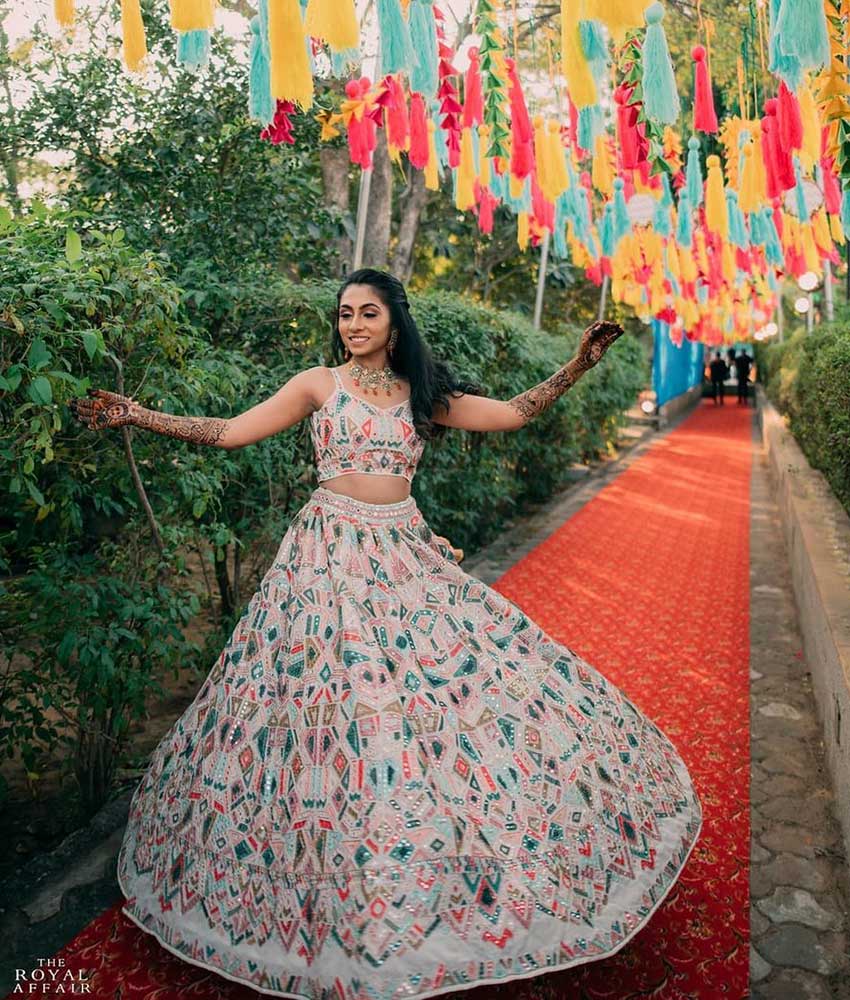 New and Unique Orange Wedding Lehenga Choli with Intricate Embellishments.