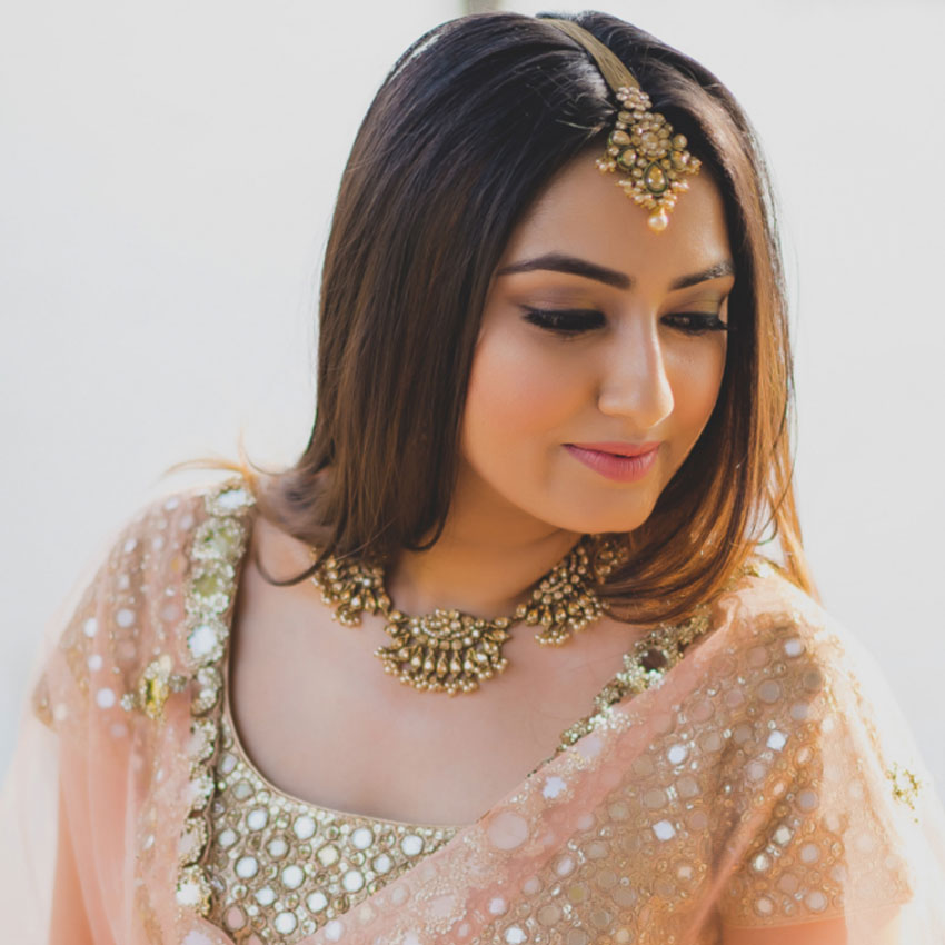 women hand being decorated with henna Tattoo. mehendi on hand, Its a  wedding dress and makeup of Indian bride for Haldi function Stock Photo -  Alamy